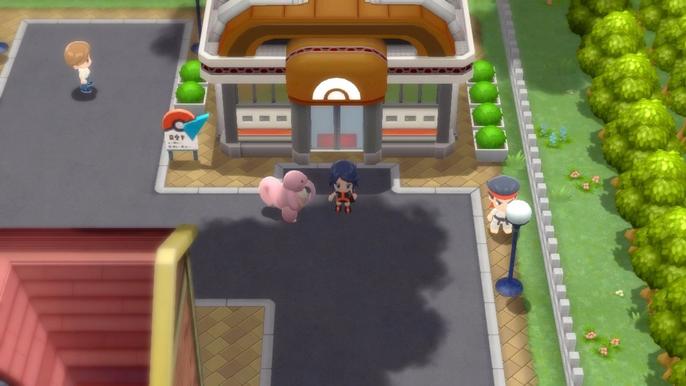 A Pokémon Trainer and their Lickitung outside of Hearthome City Gym in Pokémon Brilliant Diamond and Shining Pearl.
