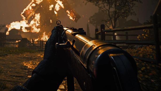 Image showing MP40 SMG in front of burning windmill