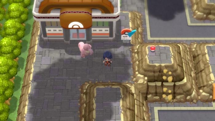 A Pokémon Trainer and their Lickitung standing outside Pastoria City Gym in Pokémon Brilliant Diamond and Shining Pearl.
