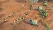 A battle in Age of Empires 4 between two civilisations on a desert terrain.