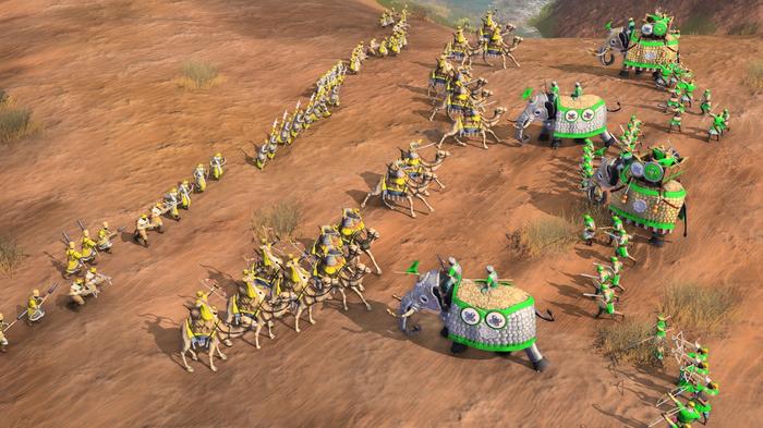 Two civilisations going to battle in a desert terrain in Age of Empires 4.