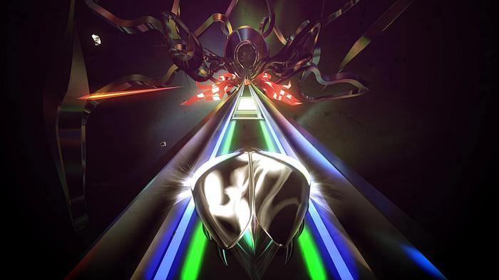 The beetle rides along a coloured track towards a boss in Thumper.