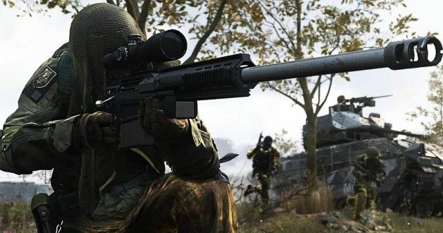 Warzone 2 player holding sniper rifle wearing ghillie suit