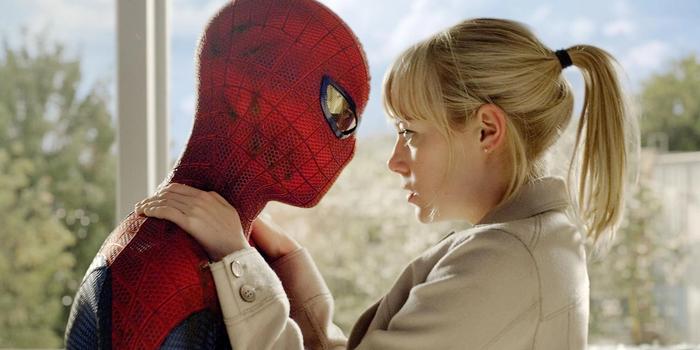 Spider-Man and Gwen Stacy are looking at each other.