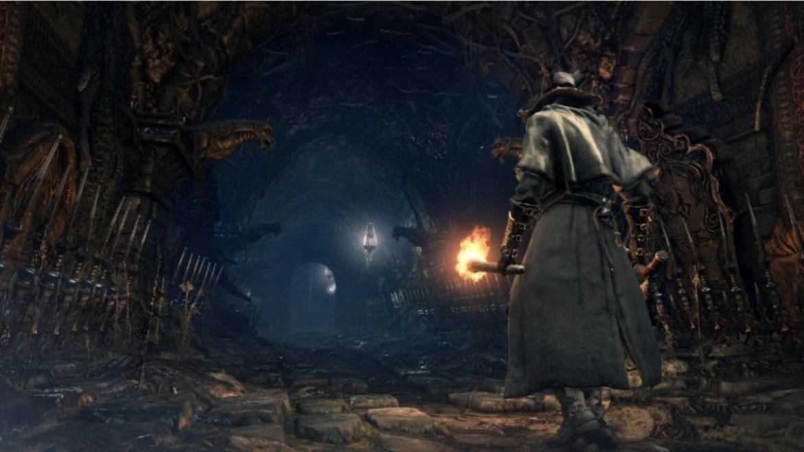 A character walking down a dark cave in Bloodborne.