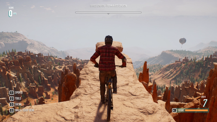 A player about to jump from a cliff riding a bike