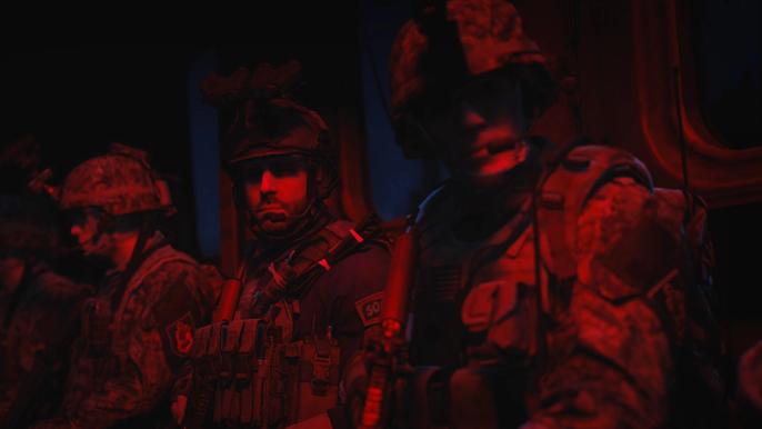 Modern Warfare 2 soldiers sat down under red lights