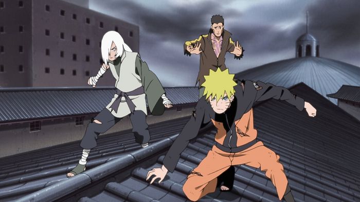 Naruto and two allies climbing roofs in the Naruto The Movie Blood Prison poster