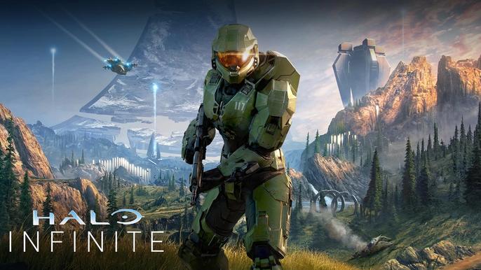 Master Chief poses in front of a battlefield in Halo Infinite