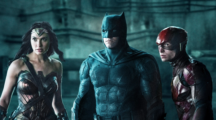 Wonder Woman, Batman, and The Flash stand in a medium shot.