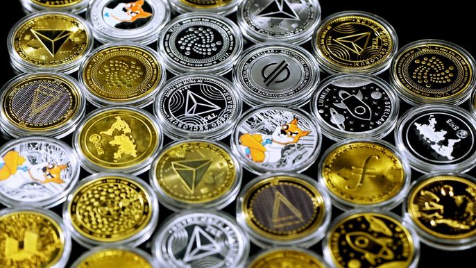 Various cryptocurrency tokens on a table.