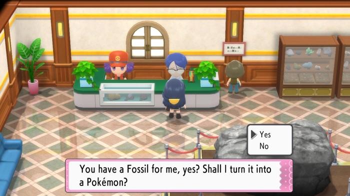 A Pokémon Trainer speaks with the Scientist at the counter of the Oreburgh Mining Museum in Pokémon Brilliant Diamond and Shining Pearl, to extract a Pokémon from a fossil