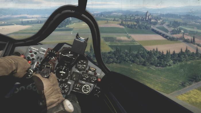 Image of the first-person character steering a plane in War Thunder.