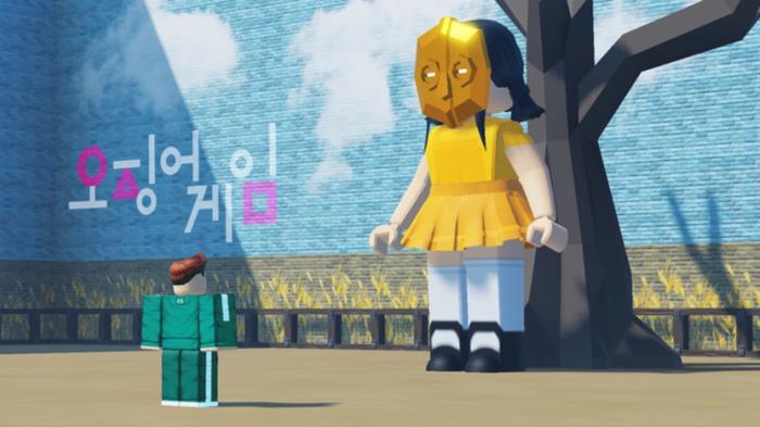 Screenshot from Fish Game, with a Roblox player facing the ominous yellow doll from Squid Game