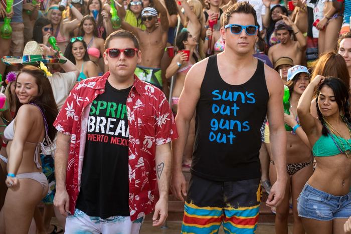 Channing Tatum and Jonah Hill are walking through a party in 22 Jump Street.