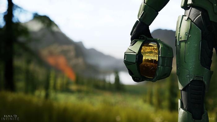 Master Chief holds his helmet by his side.