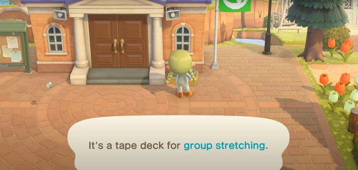 The Tape Deck in front of the Animal Crossing: New Horizons Town Hall is used to start Group Stretching.