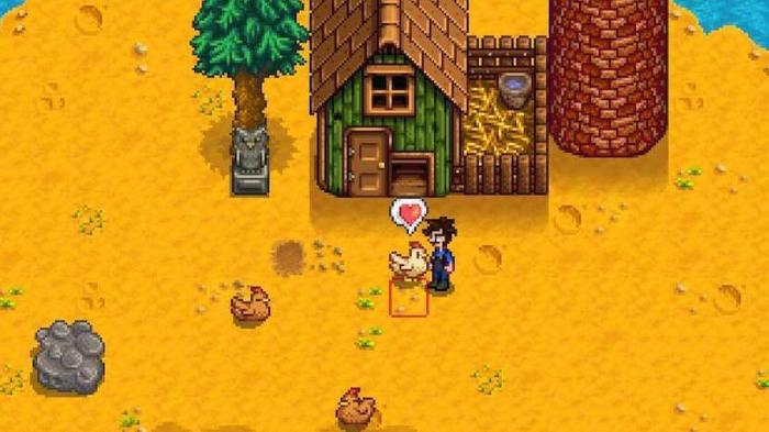 Stardew Valley. The player is interacting with their chickens outside their coop. The player is in the middle and interacting with a white chicken on their left. The white chicken has a love heart above its head. There are two brown chickens laying down on the ground near the bottom of the image. 