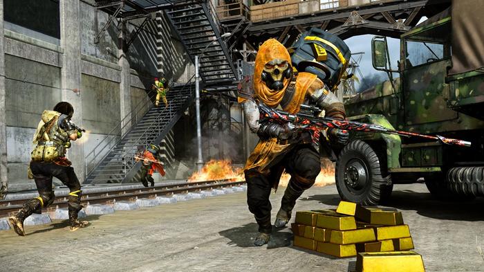 Image showing Warzone players fighting in front of gold bars