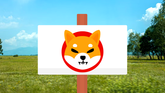 Shiba Inu logo on a for sale sign behind field