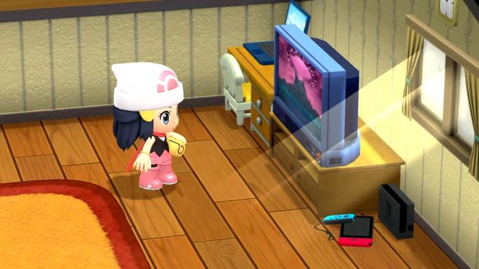 Gameplay from Pokémon Brilliant Diamond and Shining Pearl, showing the female protagonist in a chibi style watching the television.