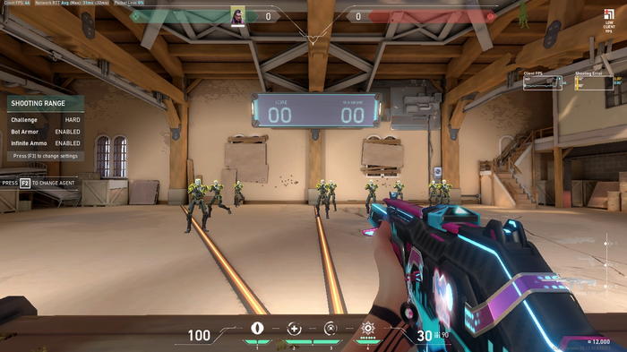 Valorant player aiming at practice bots without a crosshair.