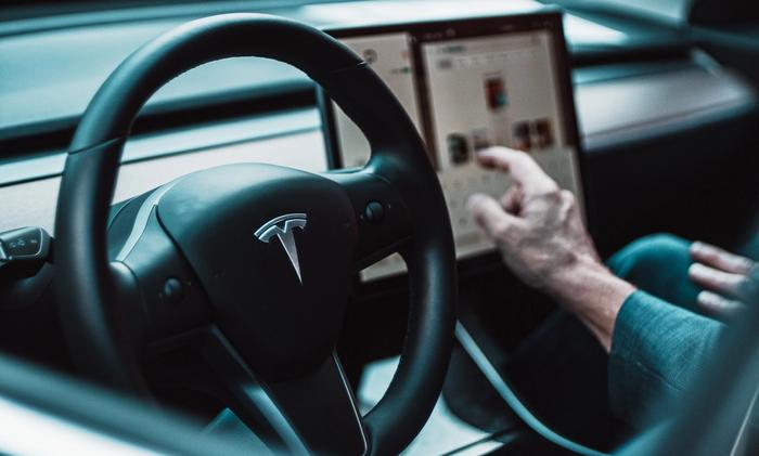 Tesla's logo on a steering wheel