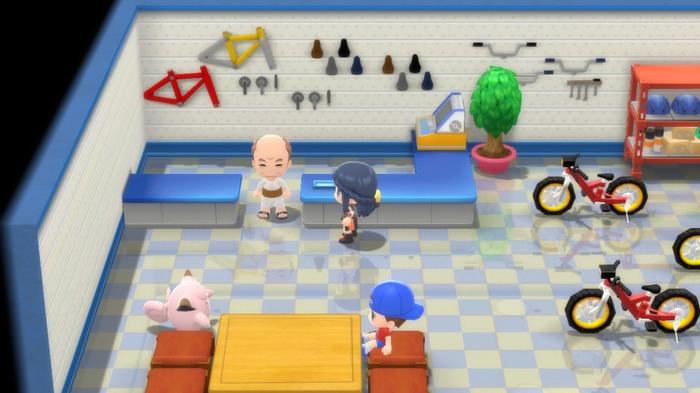 A Pokémon Trainer is inside the Cycle Shop of Eterna City in Pokémon Brilliant Diamond and Shining Pearl.