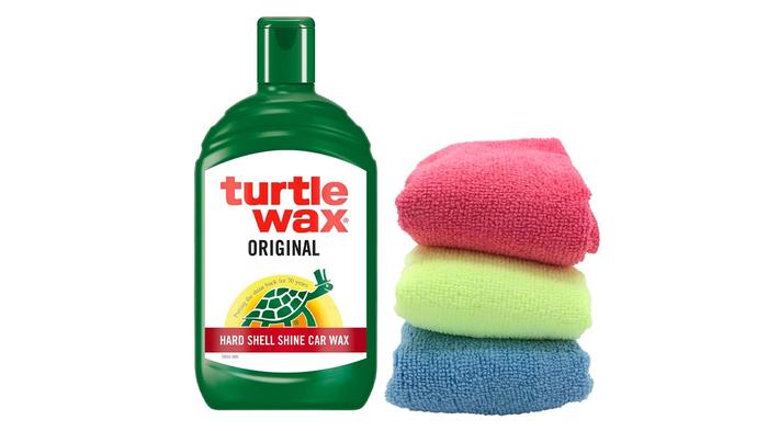 Best car cleaning products  Turtle Wax Original Car Polish product image of a green bottle with a white and red label next to blue, yellow, and red microfibre clothes.