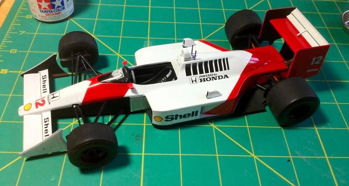 McLaren Honda MP4/4 1988 product image of a white and red Honda branded F1 car model.