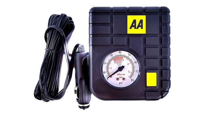 Best car tyre inflator AA product image of a compact black and yellow machine with an analogue air pressure gauge.
