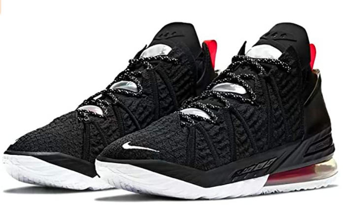 Basketball shoes vs Running shoes Nike product image of a pair of black sneakers with white soles.
