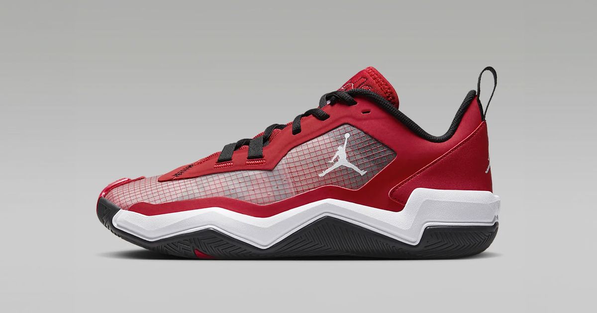 A Jordan in red with a white and black sole, white Jordan branding on the side, and mesh details.