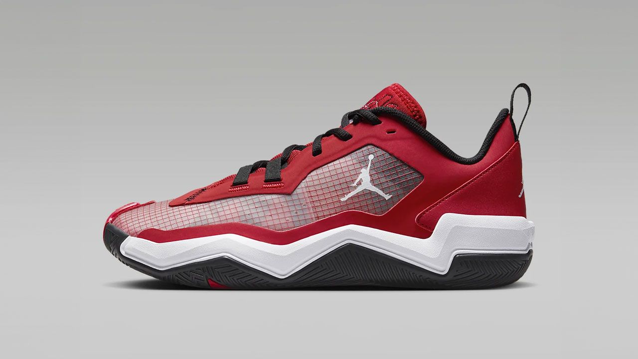 A Jordan in red with a white and black sole, white Jordan branding on the side, and mesh details.