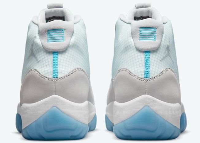 Air Jordan 11 Adapt product image of a white and light blue sneaker.