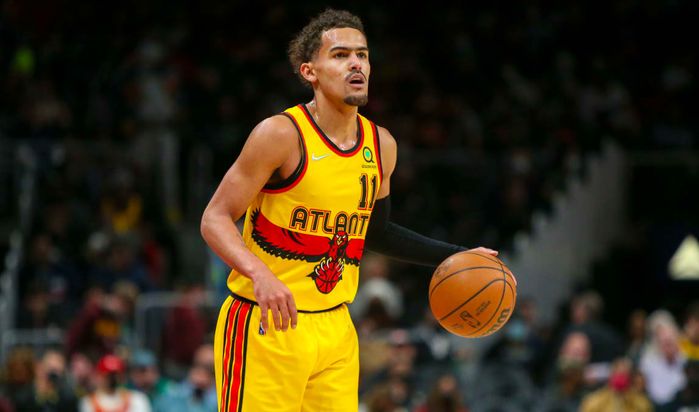 Best NBA jerseys of all time Atlanta Hawks product image of Trae Young wearing a yellow City Edition kit featuring a red hawk.