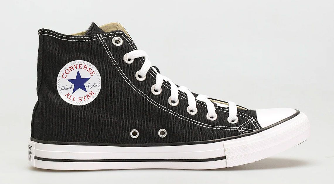 Converse Chuck Taylor All Star product image of a black canvas shoe with white details.