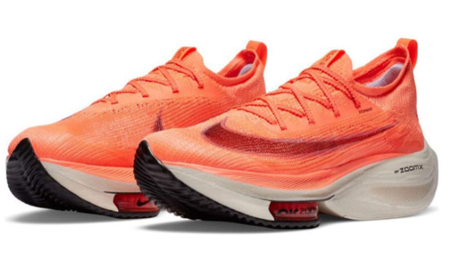 Are basketball shoes good for running Nike product image of a pair of mango citron red sneakers.