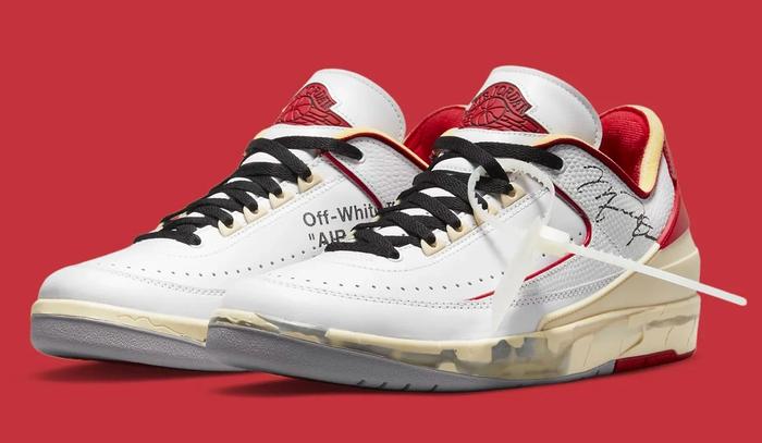 Best Air Jordan 2 colorways Off-White collaboration product image of a pair of white low-tops with red and sail details.