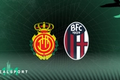 RCD Mallorca and Bologna badges with green background