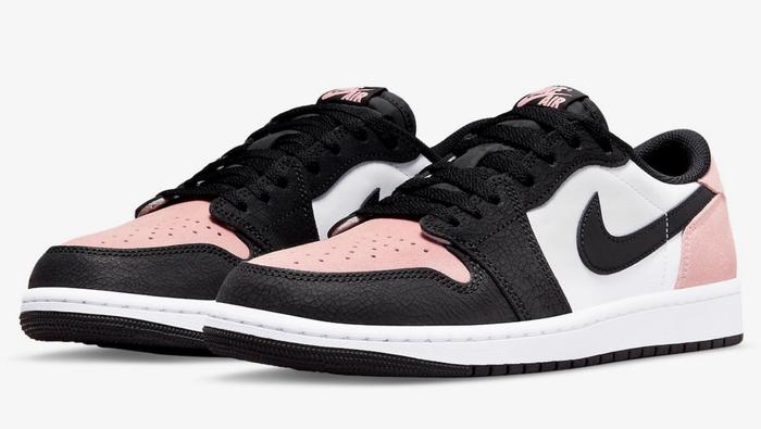 Best Air Jordan 1 Low "Bleached Coral" product image of a pair of white sneakers with light pink and black suede overlays.