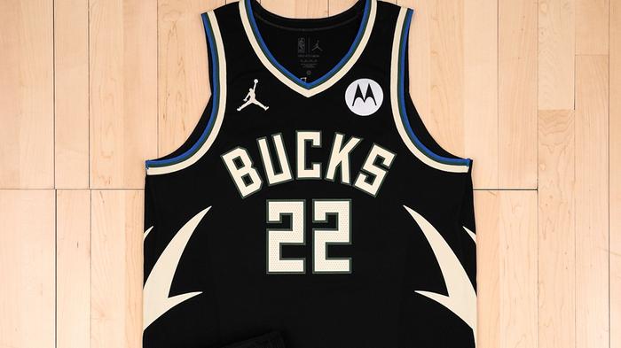 Milwaukee Bucks Statement Edition Jersey product image of a black sleeveless uniform with white antler graphics on the sides and blue accents.