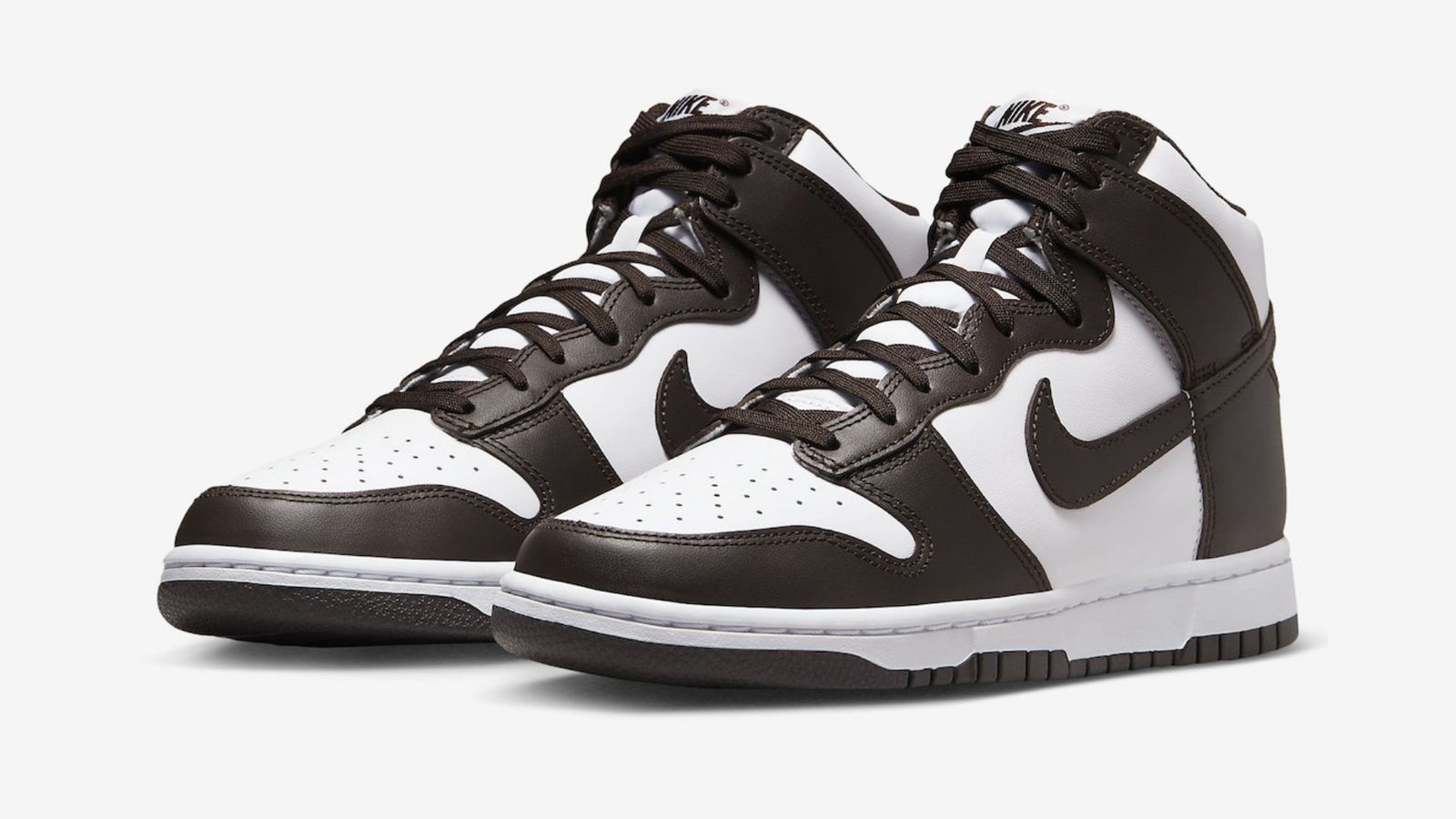 Nike Dunk High "Palomino" product image of a pair of white and dark brown high-top sneakers.