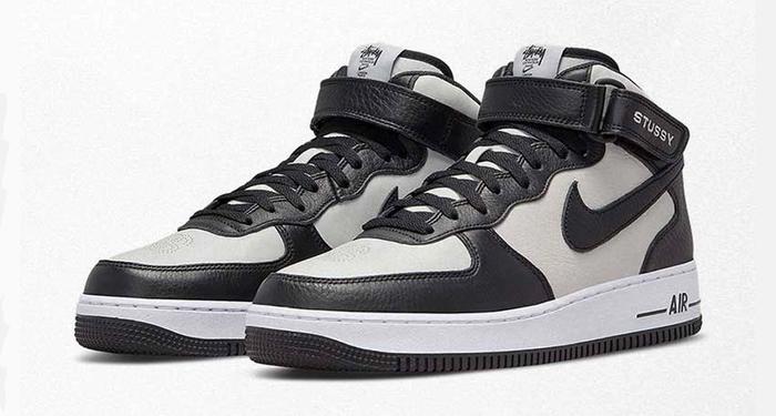Best Air Force 1 Stüssy Mid "Light Black Bone" product image of a pair of mid-top black and grey sneakers.