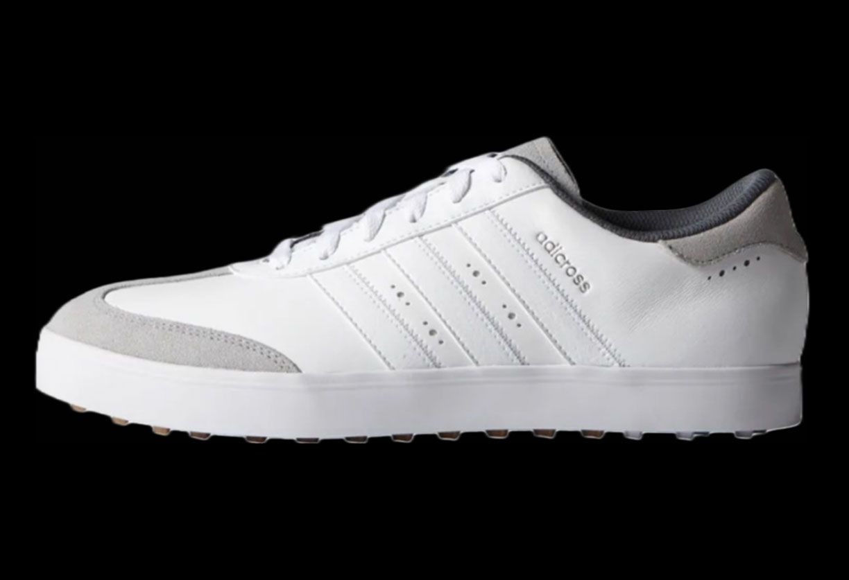 adidas Adicross V product image of a single white shoe with a grey suede toe.