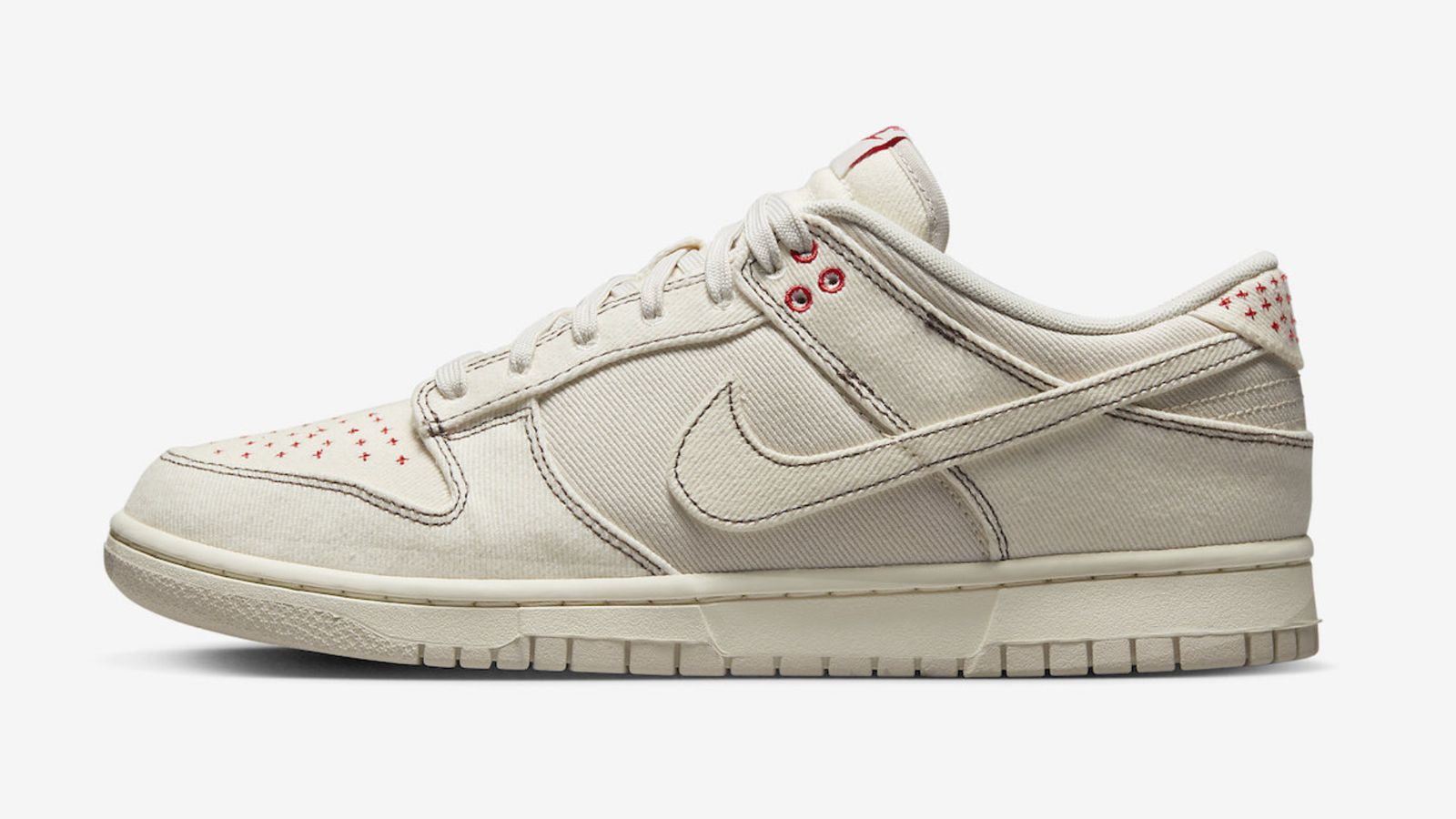 Nike Dunk Low "Light Orewood Brown" product image of a light brown and pale ivory sneaker featuring red accents.