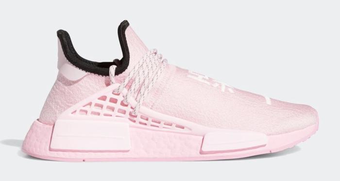 Pharrell x adidas Hu NMD Pink product image of a light pink knitted sneaker with a black lining.