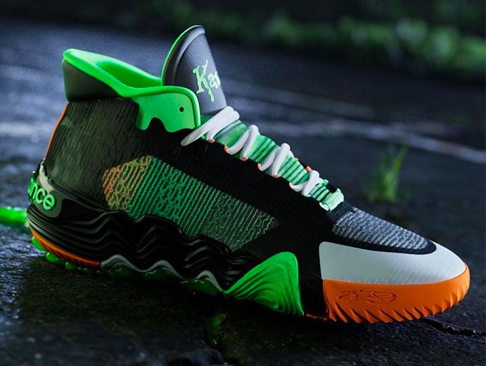 New Balance KAWHI 2 "Goosebumps" product image of a black sneaker with green and orange details.