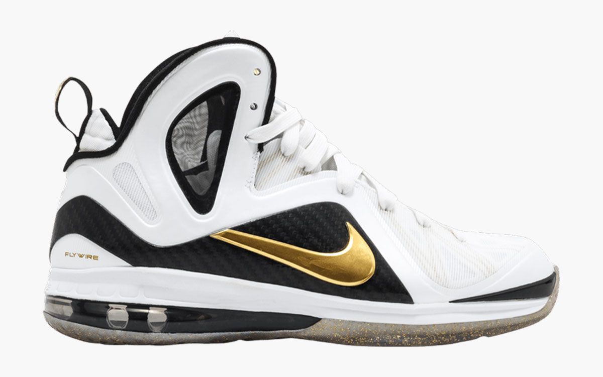 Nike LeBron 9 PS Elite "Home" product image of a white and black sneaker with metallic gold details.