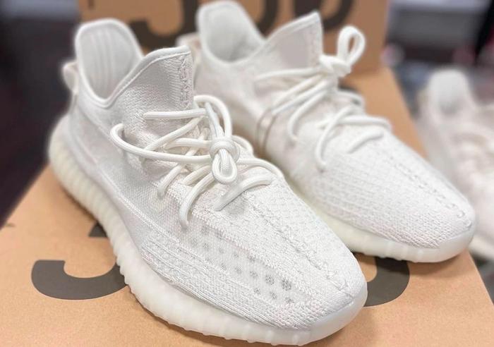 Yeezy Boost "Pure Oat" product image of an all white sneaker.